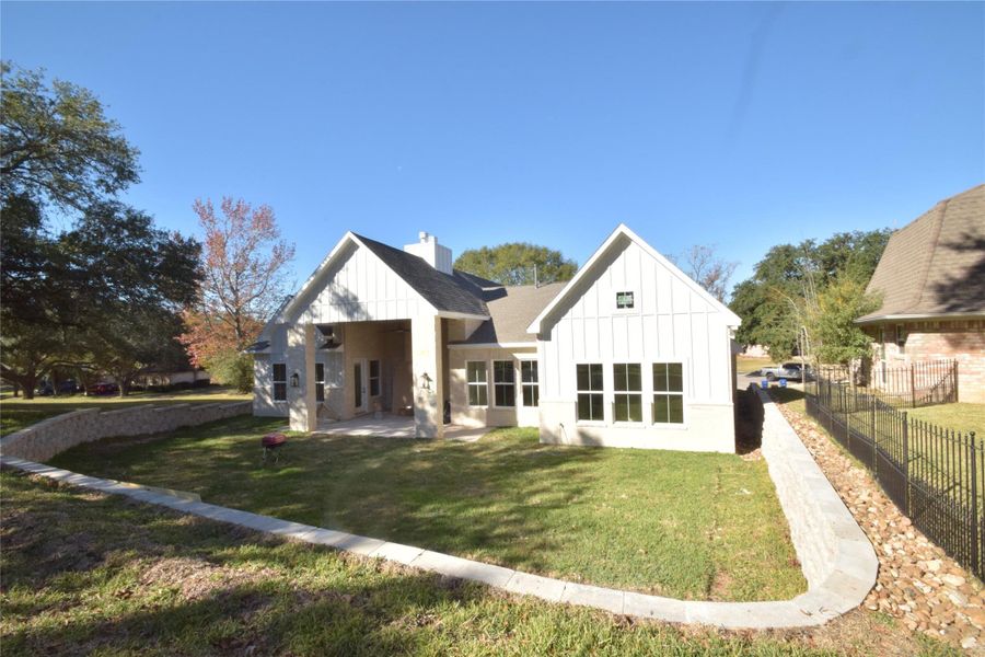 Front exterior of a new home in , Huntsville, TX, highlighting curb appeal (Image 19).