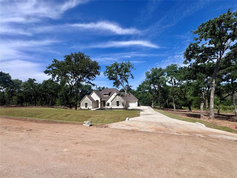 Front exterior of a new home in , Weatherford, TX, highlighting curb appeal (Image 24). Front exterior of a new home in , Weatherford, TX, highlighting curb appeal (Image 24).