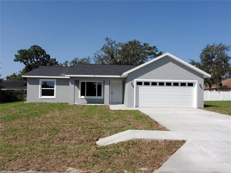 Front exterior of a new home in , Ocklawaha, FL, highlighting curb appeal (Image 22).