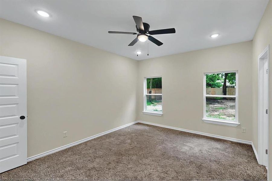 Spare room featuring carpet floors, a ceiling fan, baseboards, and recessed lighting Spare room featuring carpet floors, a ceiling fan, baseboards, and recessed lighting