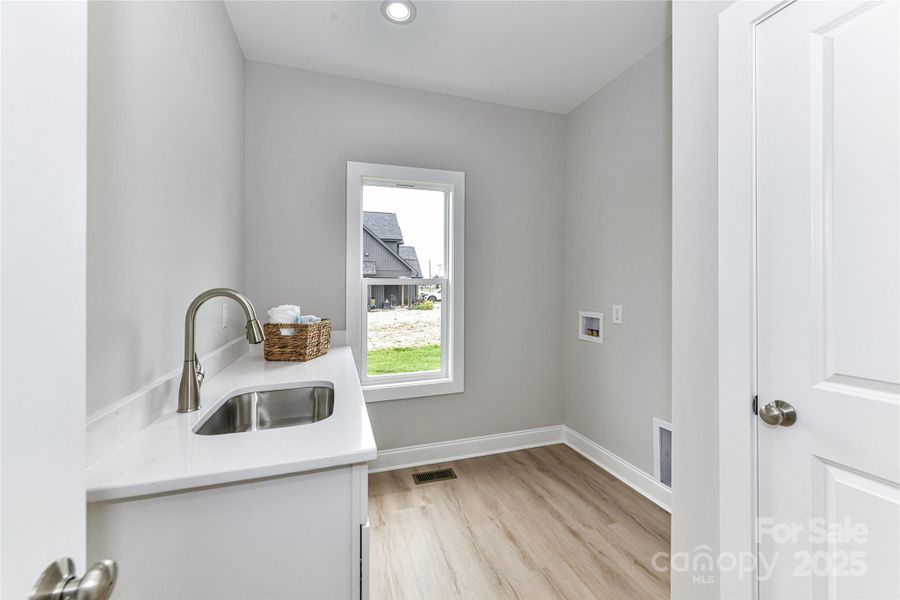 Large Laundry Room with sink on main level! Large Laundry Room with sink on main level!