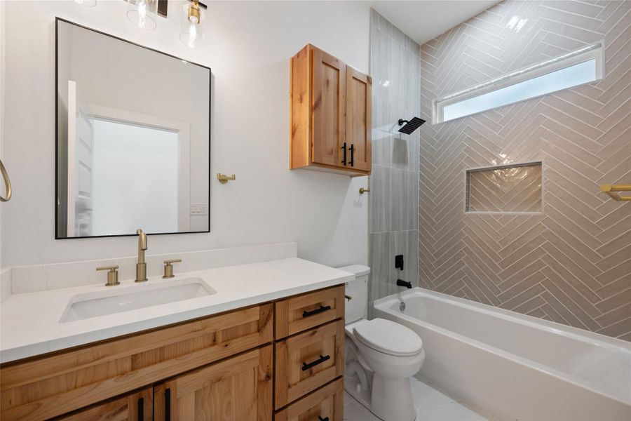 Bathroom with shower / washtub combination and vanity