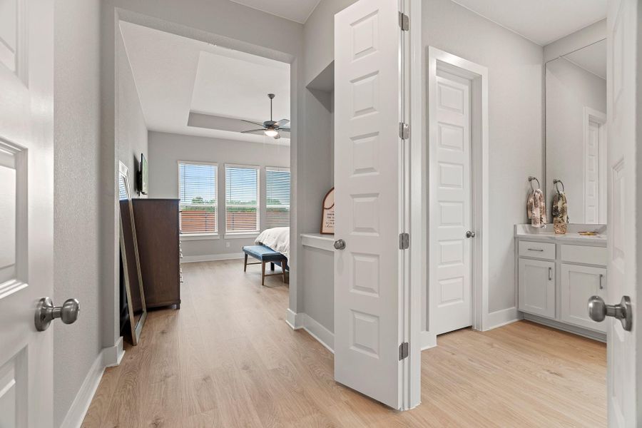 Corridor with light wood finished floors and baseboards Corridor with light wood finished floors and baseboards