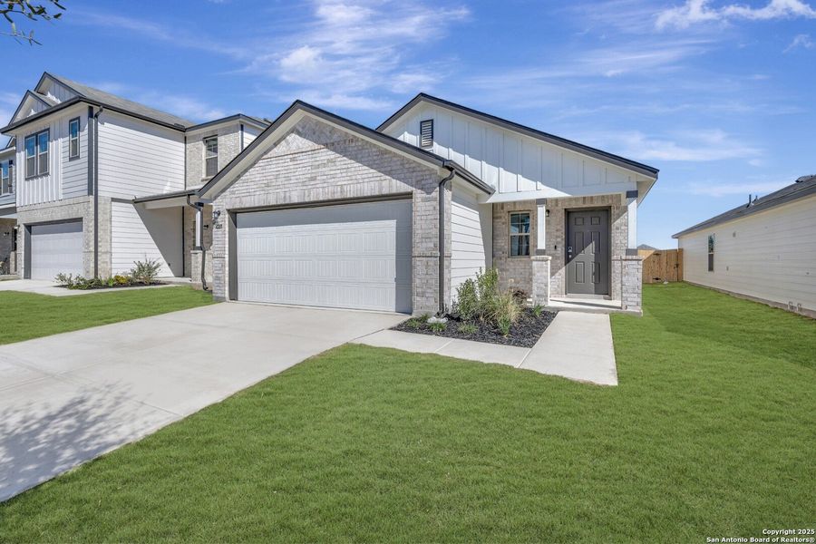 Front exterior of a new home in Park Place, New Braunfels, TX, highlighting curb appeal (Image 16). Front exterior of a new home in Park Place, New Braunfels, TX, highlighting curb appeal (Image 16).