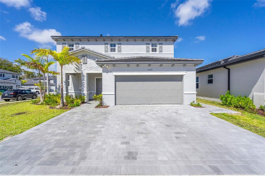 Front exterior of a new home in , Miami, FL, highlighting curb appeal (Image 25).