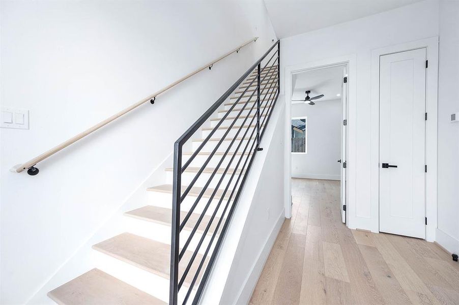 Elegant prefinished white oak flooring with convenient coat closet.