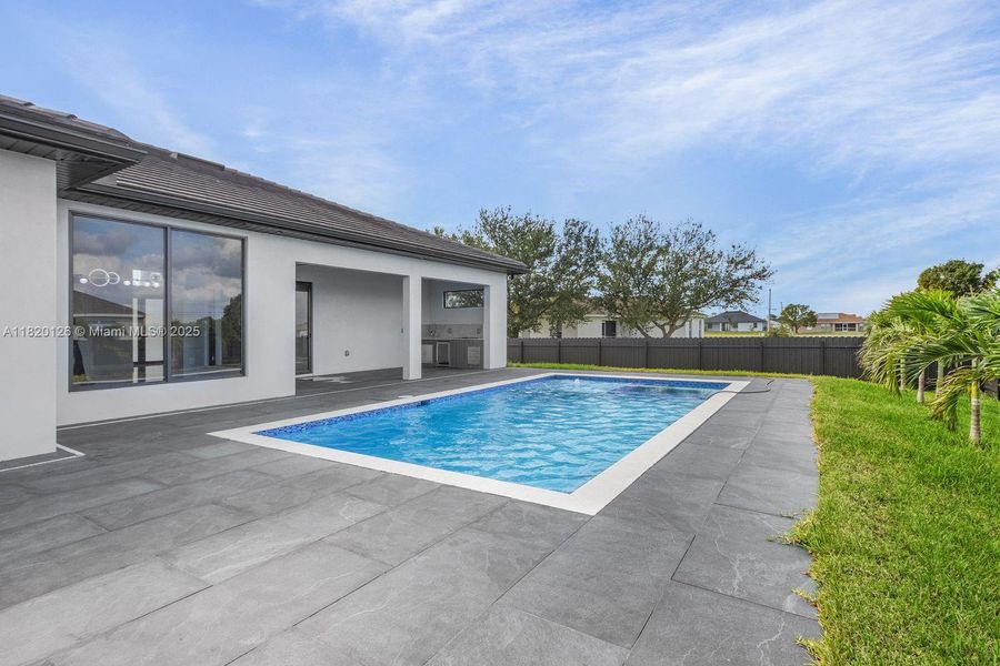 Front exterior of a new home in , Cape Coral, FL, highlighting curb appeal (Image 1).