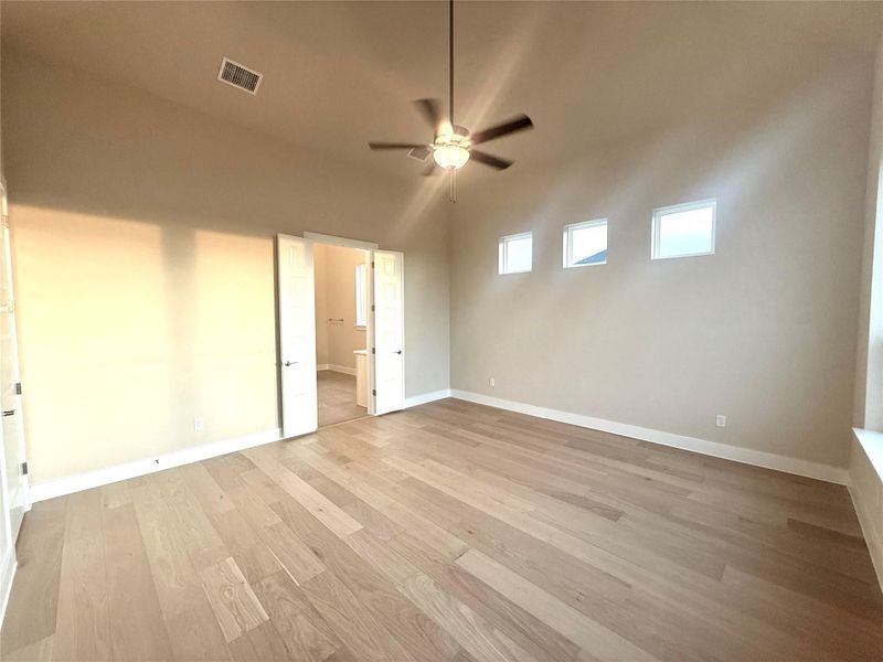 Unfurnished bedroom with light wood finished floors and a ceiling fan