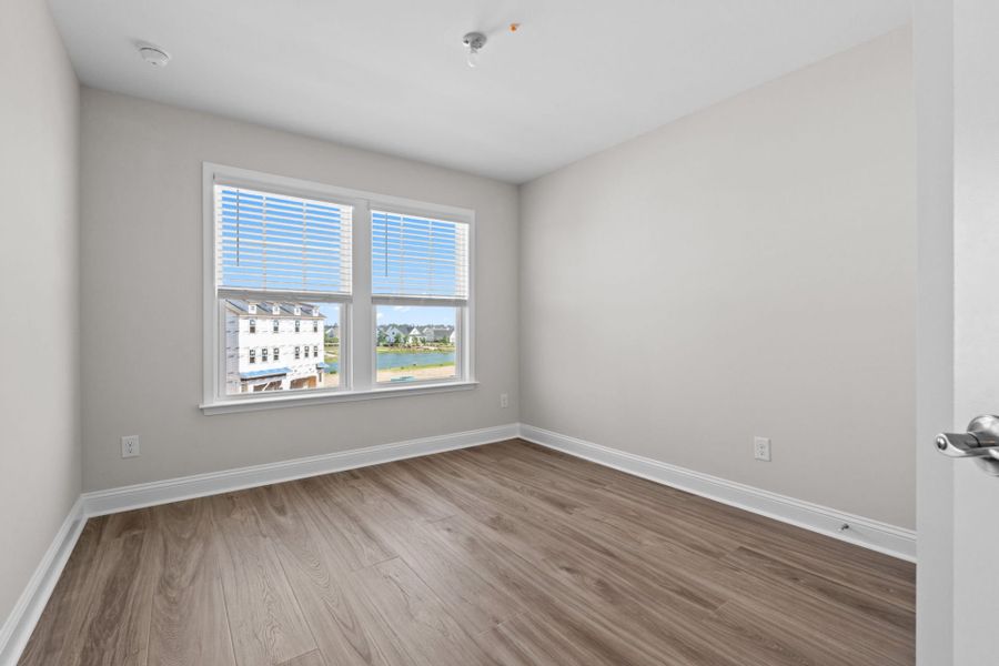 Spacious, unfurnished interior of a new home in Lakeside Townes at Riverlights, Wilmington (Image 28).