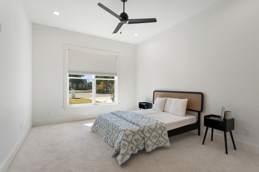 Bedroom with carpet floors, a ceiling fan, and recessed lighting