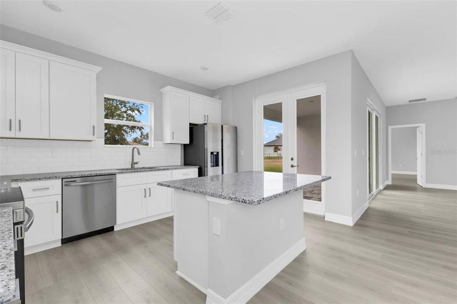 Furnished interior view inside a new home in , Port Charlotte (Image 9).