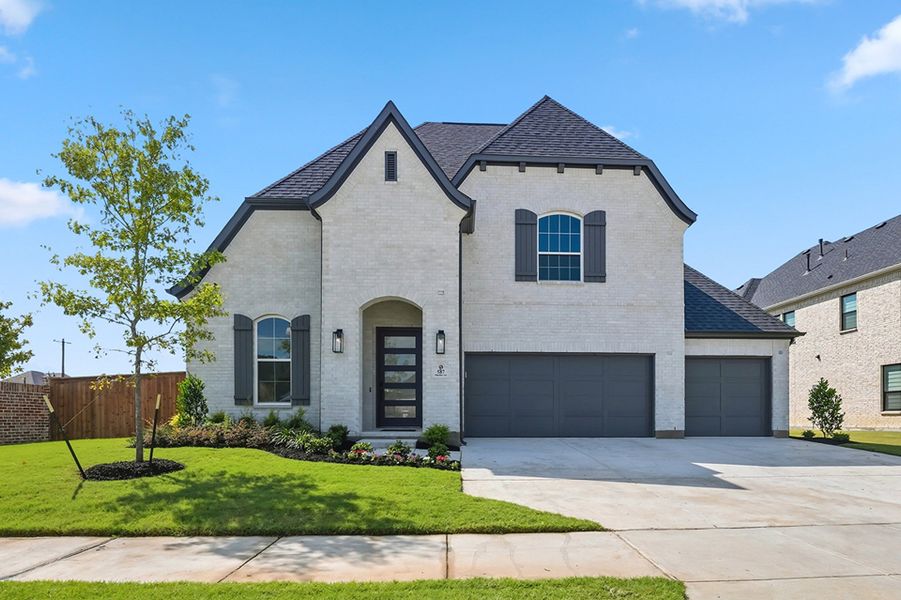 Front exterior of a new home in Estates at Rockhill, Frisco, TX, highlighting curb appeal (Image 1). Front exterior of a new home in Estates at Rockhill, Frisco, TX, highlighting curb appeal (Image 1).
