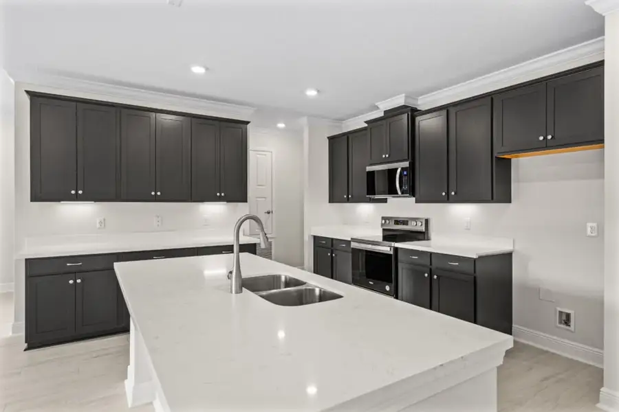 Furnished interior view inside a new home in Windswept Estates, Freeport (Image 5).