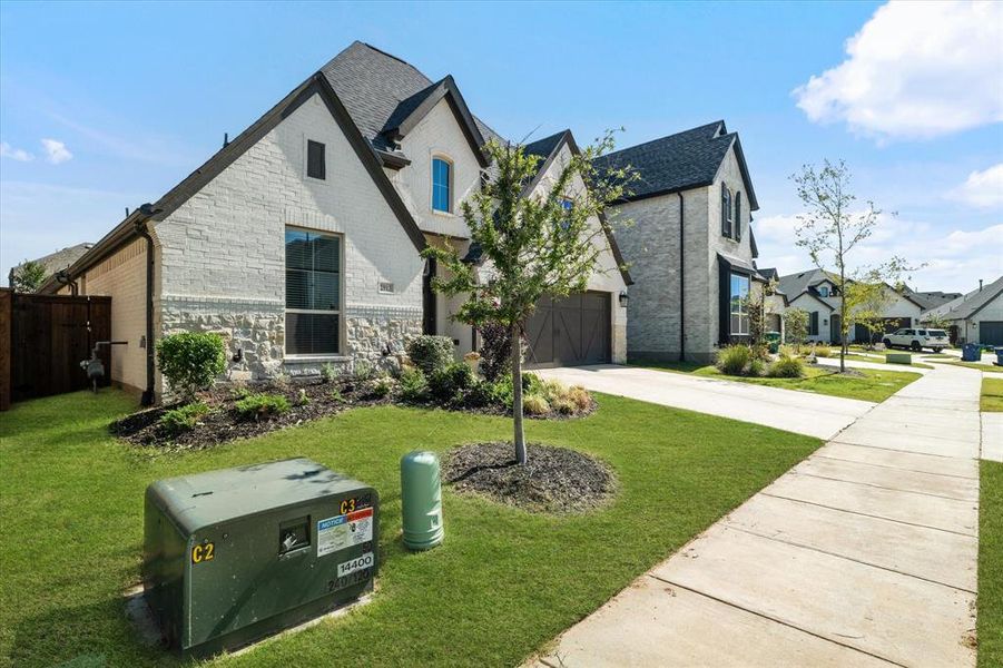 Front exterior of a new home in Cambridge Crossing 50', Celina, TX, highlighting curb appeal (Image 21). Front exterior of a new home in Cambridge Crossing 50', Celina, TX, highlighting curb appeal (Image 21).