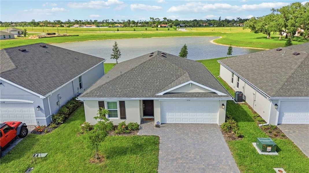 Front exterior of a new home in Central Parc, North Port, FL, highlighting curb appeal (Image 23).
