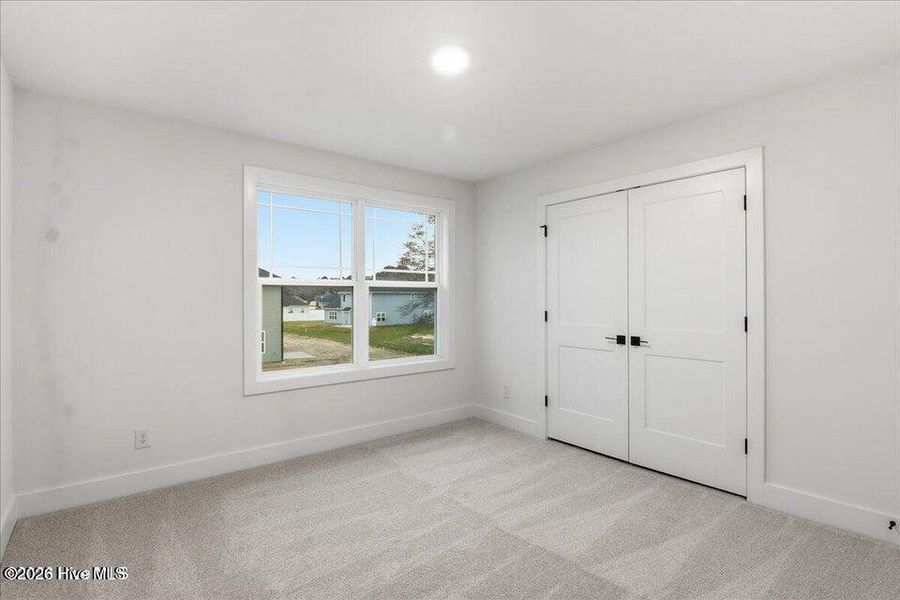 Spacious, unfurnished interior of a new home in Wood Creek Landing, Leland (Image 31).