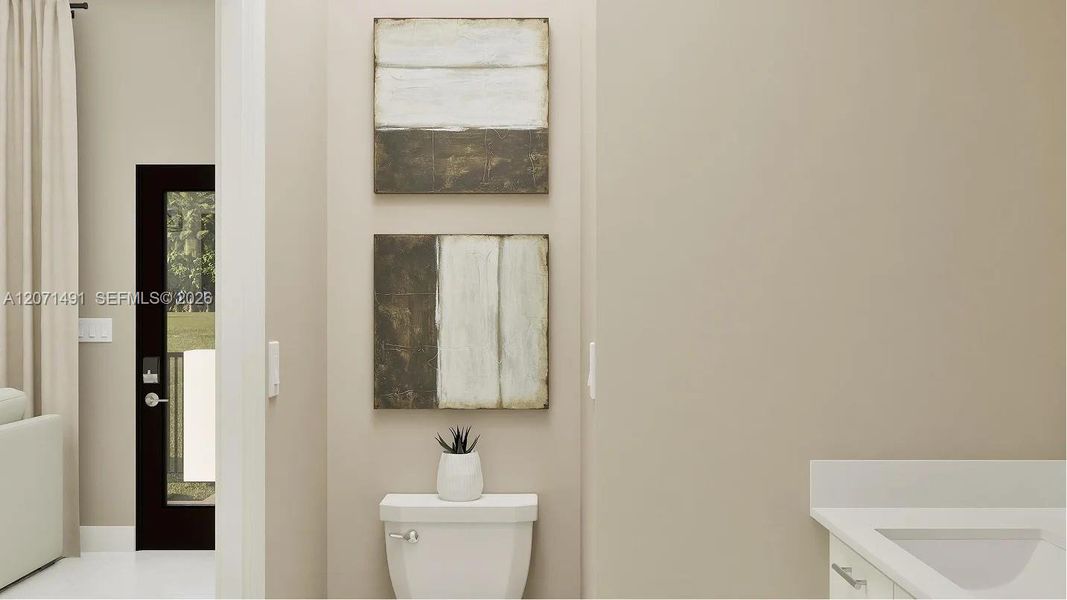 The powder room provides first-floor convenience for guests and residents alike.
