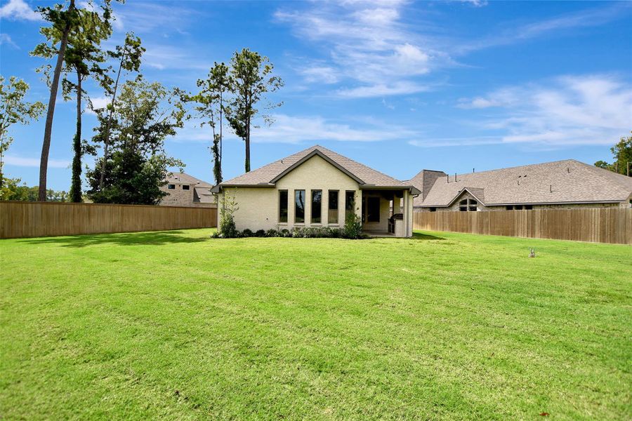 Exterior details and patio area of a home in The Highlands, Porter (Image 30).