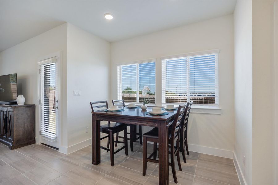 Dining space featuring healthy amount of natural light and recessed lighting Dining space featuring healthy amount of natural light and recessed lighting