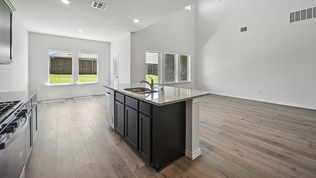Representative furnished interior of a home built from the Tangerine by D.R. Horton in Woodcreek, Fate (Image 6).