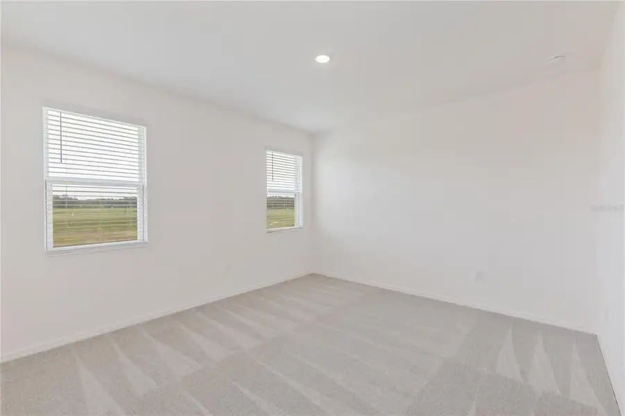 Spacious, unfurnished interior of a new home in Highfield at Twisted Oaks, Wildwood (Image 8).