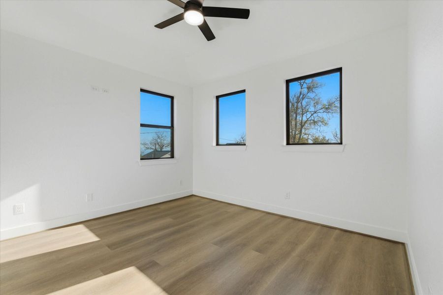 An upstairs bedroom offers 10-foot ceilings and a generously sized walk-in closet.