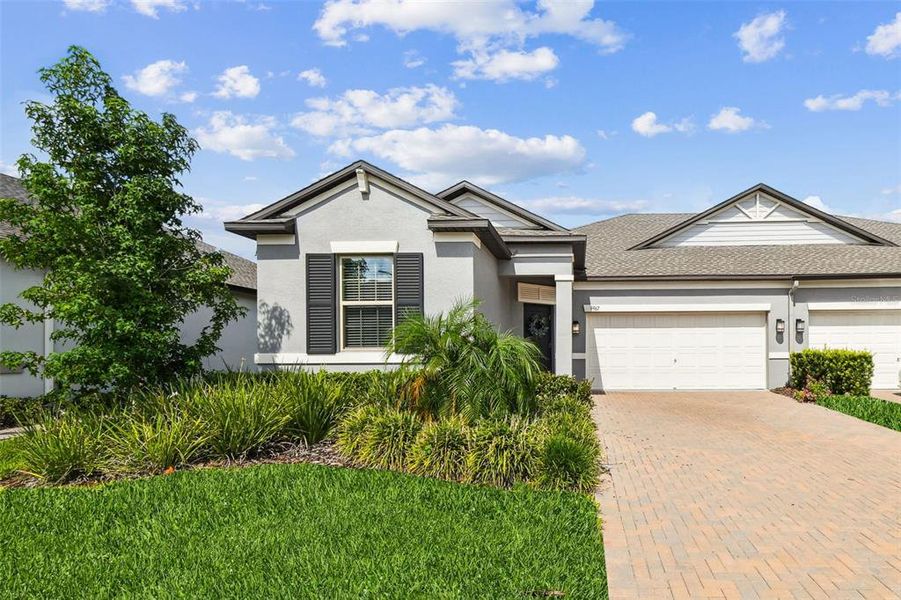 Front exterior of a new home in , Land O' Lakes, FL, highlighting curb appeal (Image 23).