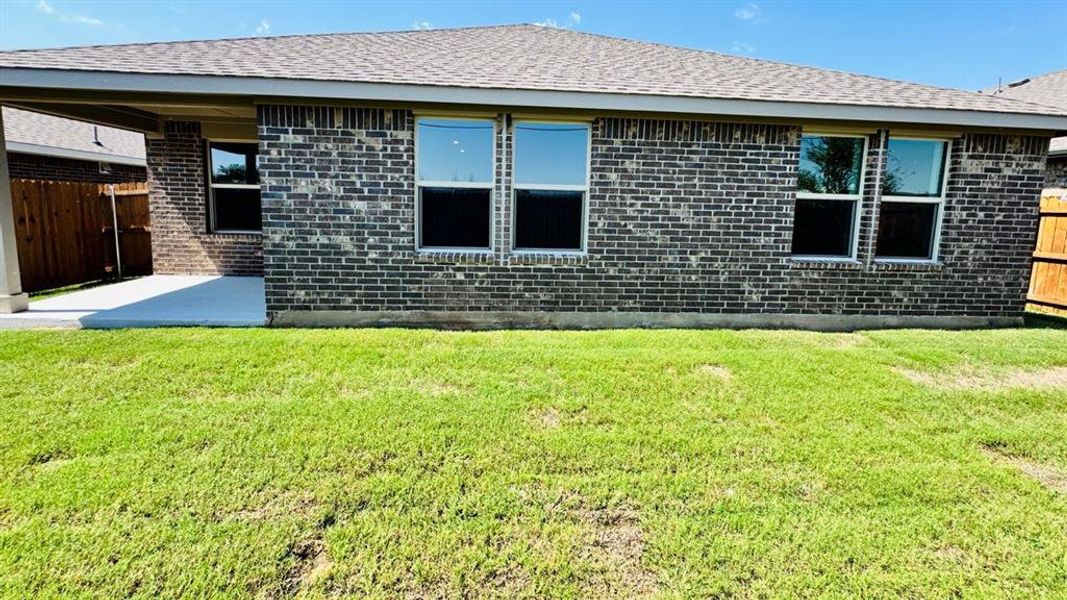 Front exterior of a new home in Meadowbrook Estates, Cleburne, TX, highlighting curb appeal (Image 14).