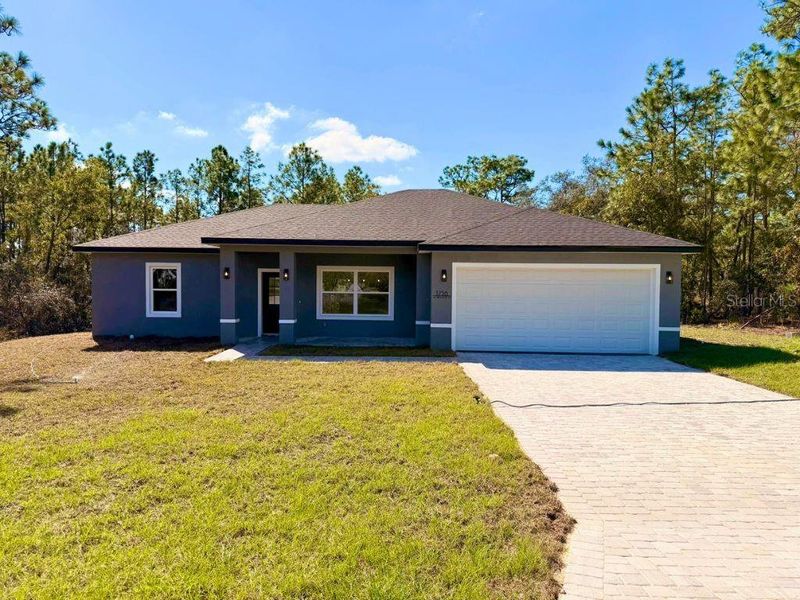 Front exterior of a new home in , Dunnellon, FL, highlighting curb appeal (Image 1). Front exterior of a new home in , Dunnellon, FL, highlighting curb appeal (Image 1).