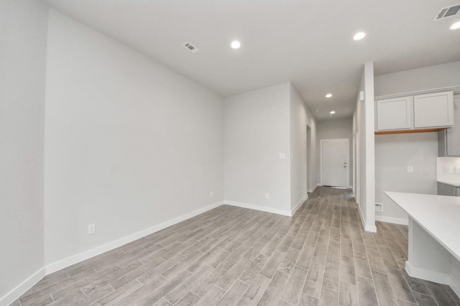 Make memories gathered around the table with your family and friends! This spacious dining room features elegant flooring, custom paint, and adjacent to family room and kitchen for open concept feel. Sample photo of completed home with similar floor plan. Actual colors and selections may vary. Make memories gathered around the table with your family and friends! This spacious dining room features elegant flooring, custom paint, and adjacent to family room and kitchen for open concept feel. Sample photo of completed home with similar floor plan. Actual colors and selections may vary.