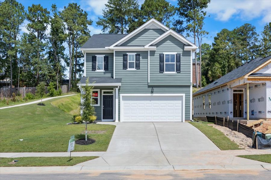 Front exterior of a new home in Forrest Bluff, North Augusta, SC, highlighting curb appeal (Image 1). Front exterior of a new home in Forrest Bluff, North Augusta, SC, highlighting curb appeal (Image 1).