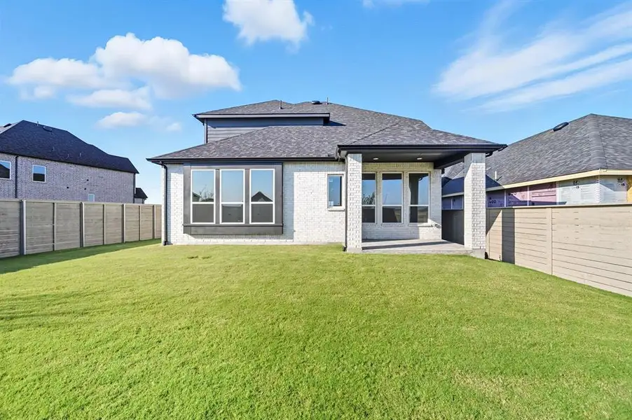 Exterior details and patio area of a home in Treeline, Justin (Image 2).