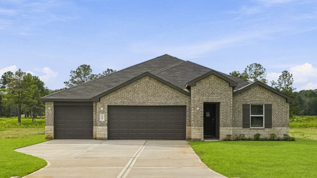 Front exterior of a new home in East Williams Cove, Conroe, TX, highlighting curb appeal (Image 1). Front exterior of a new home in East Williams Cove, Conroe, TX, highlighting curb appeal (Image 1).
