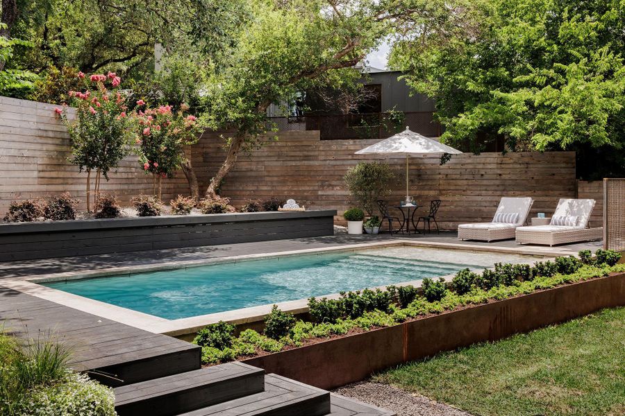 View of swimming pool with a wooden deck View of swimming pool with a wooden deck