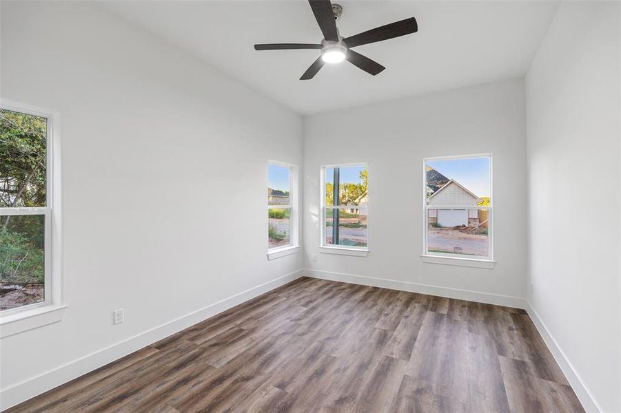 Spare room with ceiling fan and hardwood / wood-style floors