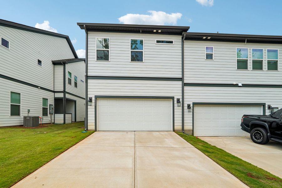 Front exterior of a new home in Terraces at the Exchange, Indian Land, SC, highlighting curb appeal (Image 17).