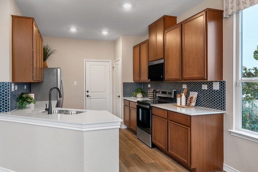 Representative furnished interior of a home built from the 1389 Modeled by KB Home in The Granary - Villa Collection, San Antonio (Image 7).