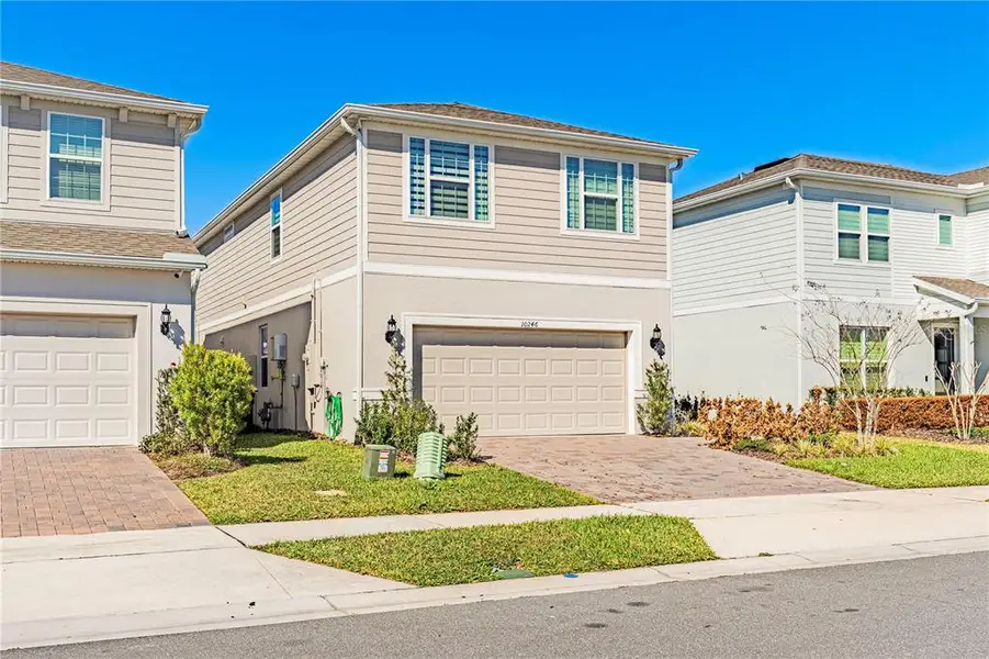Front exterior of a new home in , Orlando, FL, highlighting curb appeal (Image 23). Front exterior of a new home in , Orlando, FL, highlighting curb appeal (Image 23).