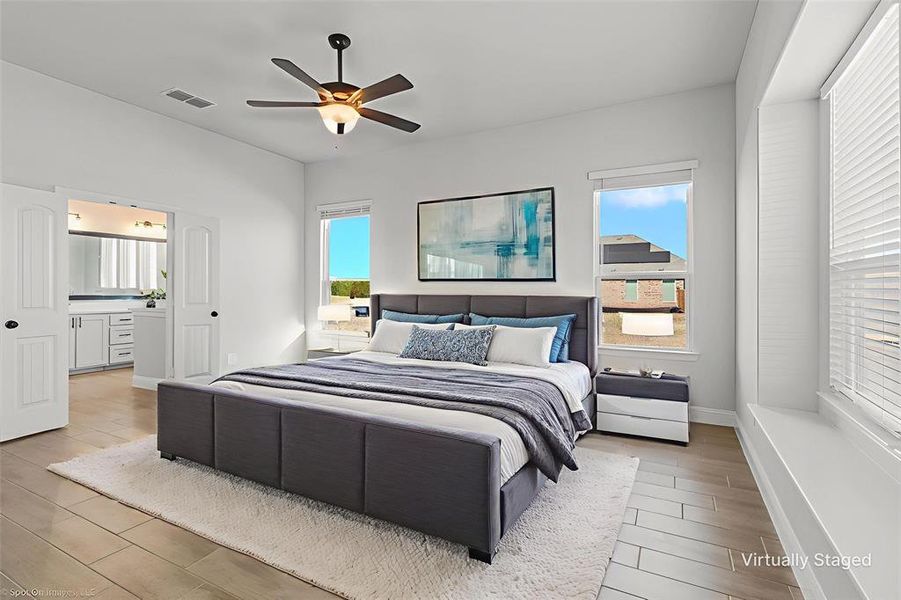 Primary bedroom on first floor staged