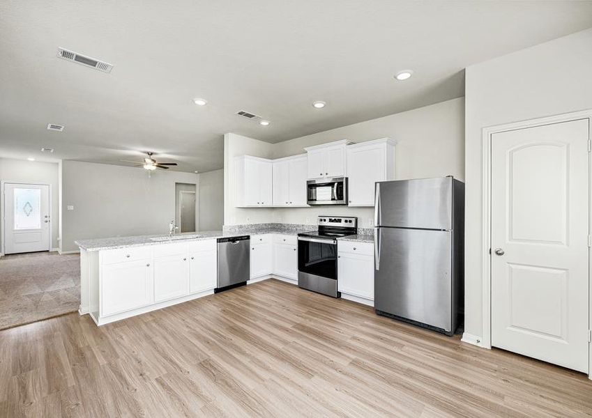 The spacious kitchen is perfect for preparing your family's favorite meals and treats.