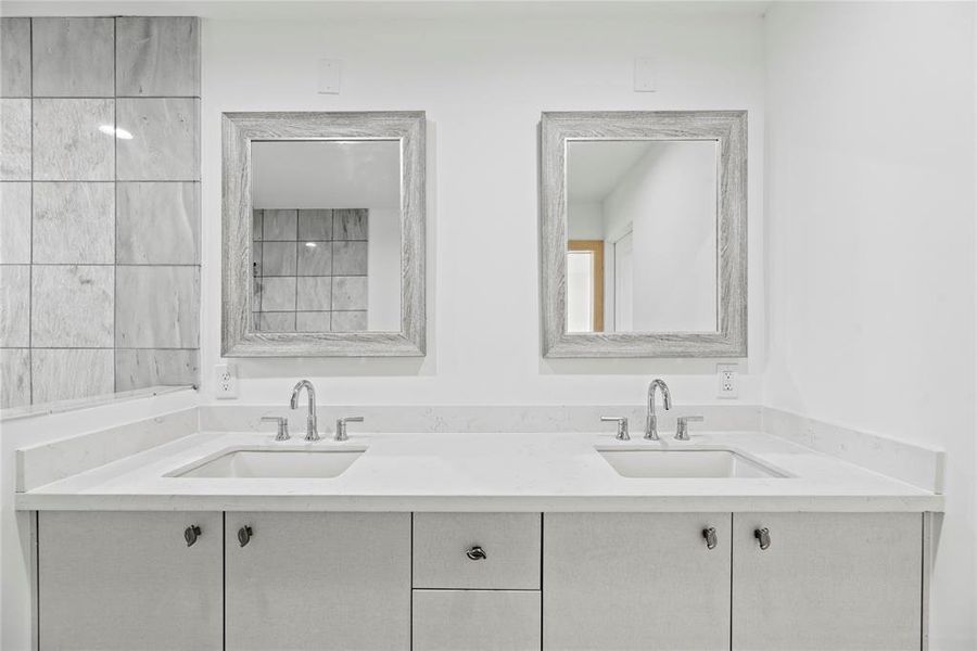 Lots of room for you to get ready for the day. Double sinks and large quartz counters give everyone their own space.