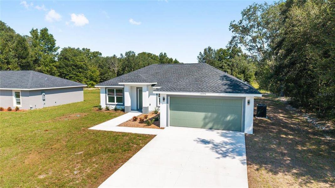 Front exterior of a new home in , Dunnellon, FL, highlighting curb appeal (Image 1).