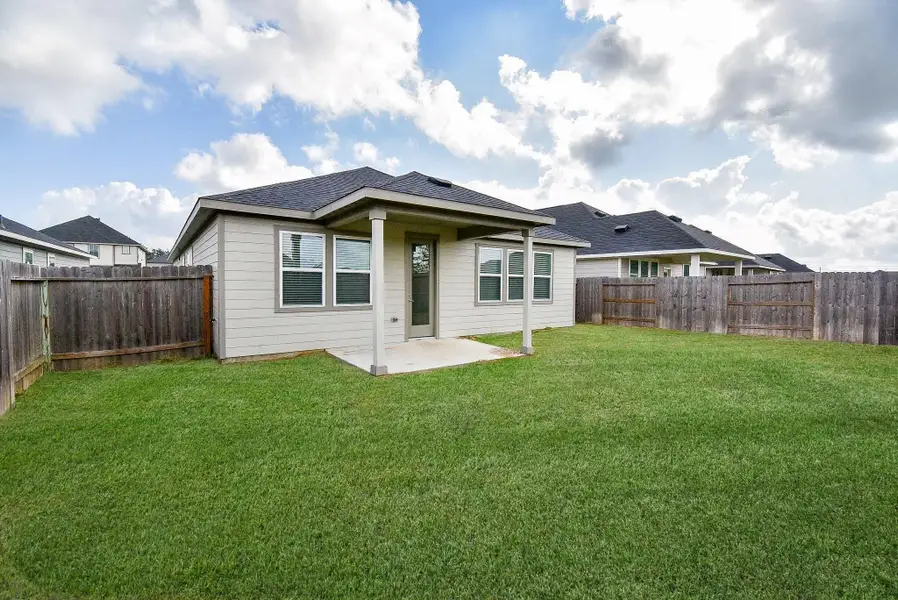SPACIOUS BACKYARD WITH COVERED BACK PATIO FOR OUTDOOR ENJOYMENT
