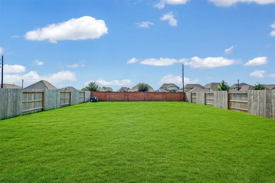 Large yard with no rear neighbors. Brick exterior maintained by HOA!