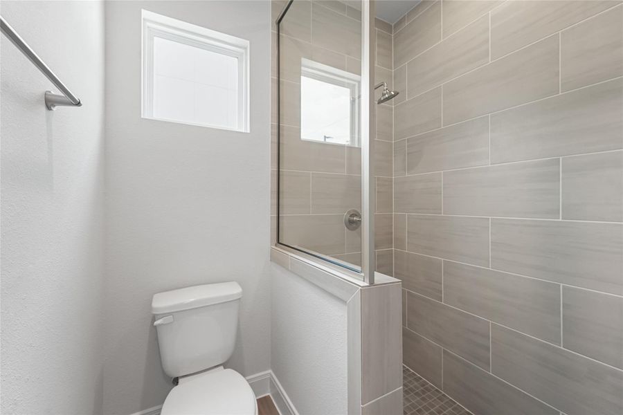 Furnished interior view inside a new home in The Corner At Buffalo Pointe, Houston (Image 19).