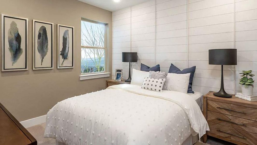 Bedroom featuring baseboards and carpet floors Bedroom featuring baseboards and carpet floors