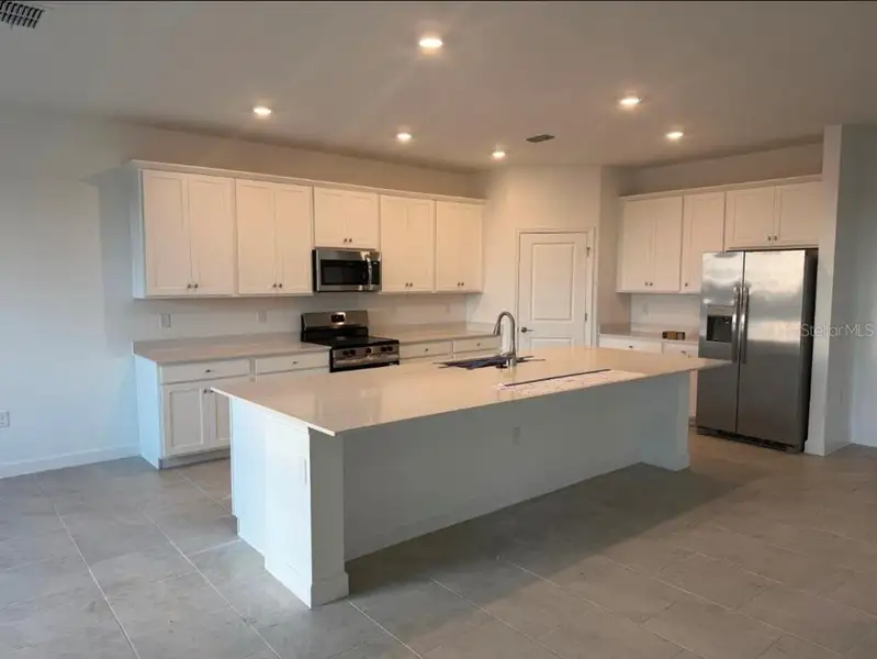Furnished interior view inside a new home in Rye Ranch: Manor Homes, Parrish (Image 7).