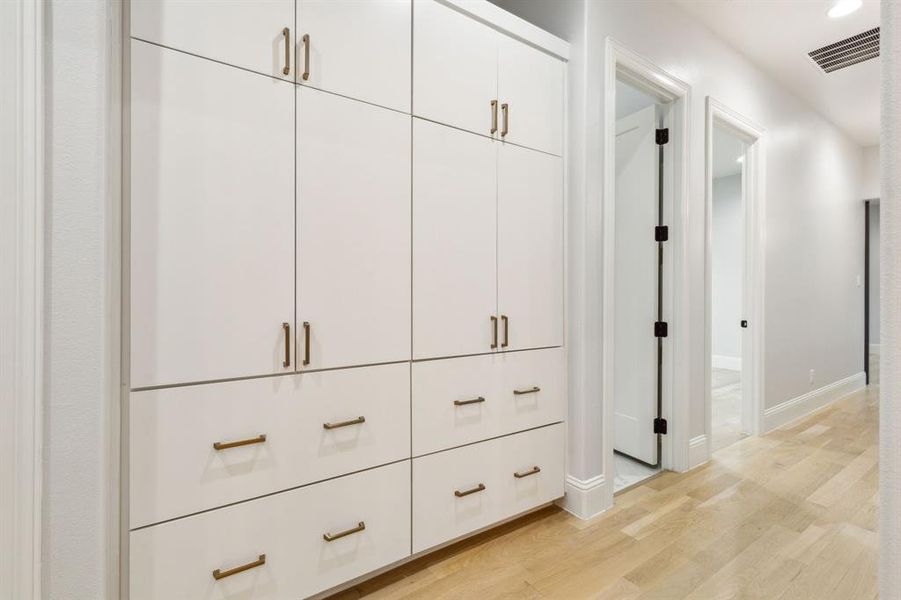 Built in cabinetry located in hallway near secondary bedrooms. There is no shortage of storage space in this house!