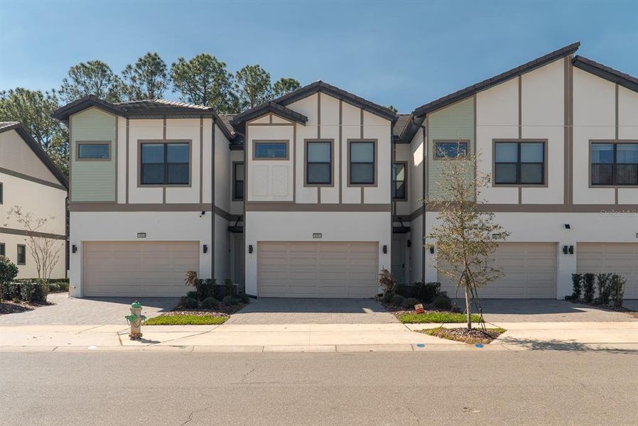 Front exterior of a new home in , Orlando, FL, highlighting curb appeal (Image 2).