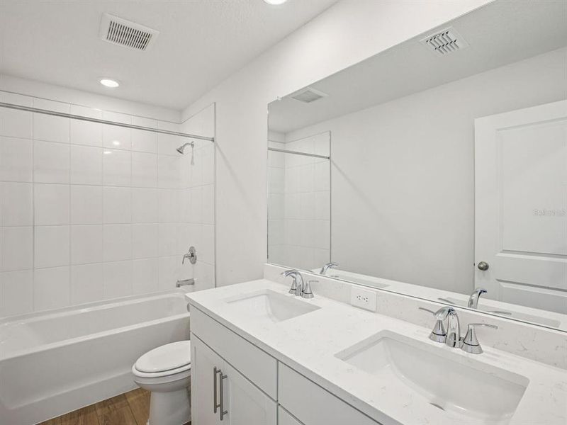 Furnished interior view inside a new home in The Grove at Stuart Crossing - Classic Series, Bartow (Image 14).